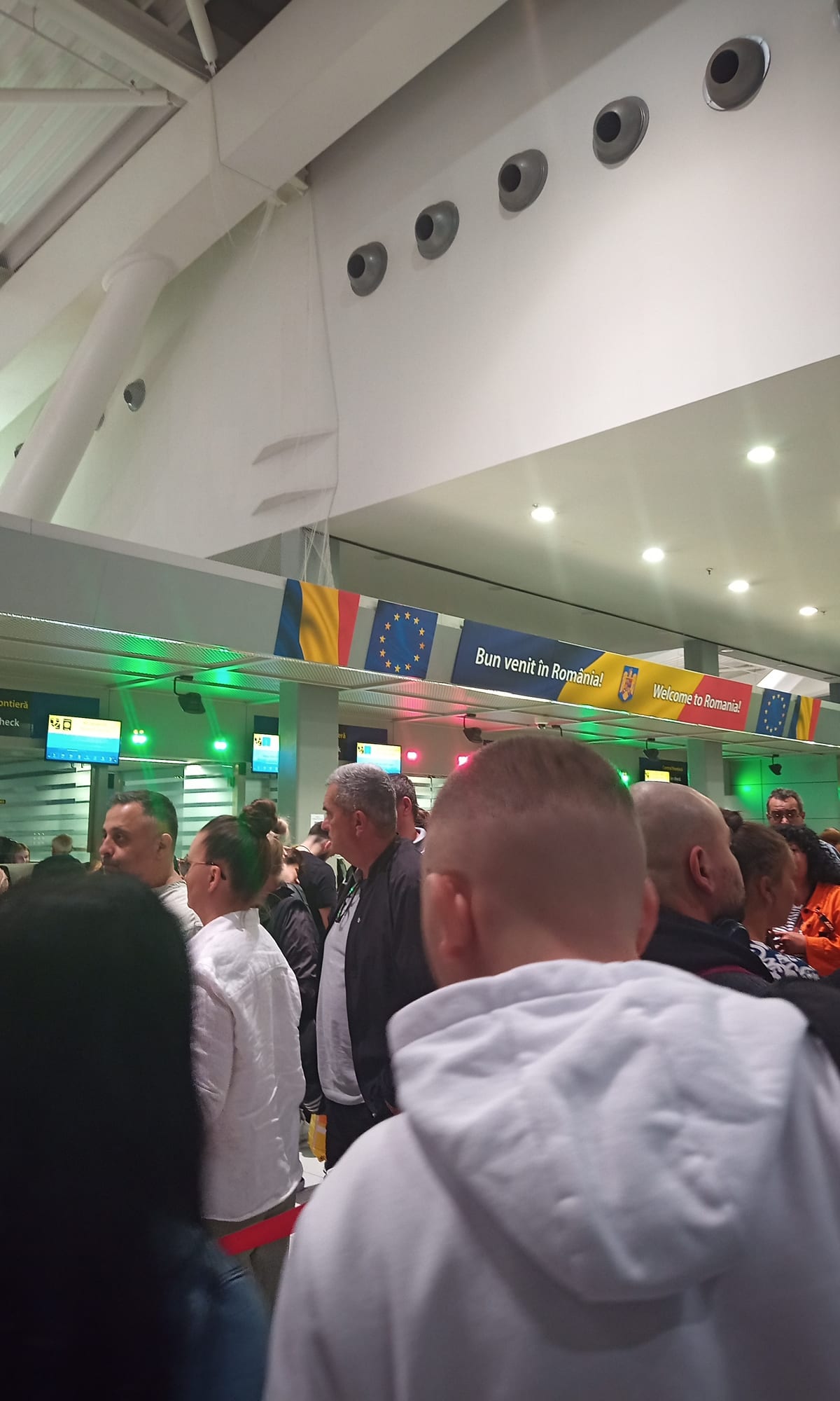 Passport control processing at an international airport during elevated travel screening conditions