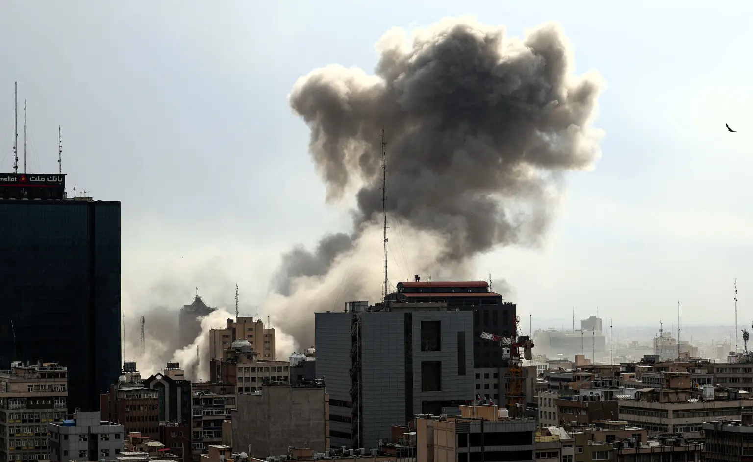 Trump promises more strikes on Iran as U.S. adds to forces in Mideast — smoke rises over Tehran skyline after US-Israeli airstrikes during Operation Epic Fury