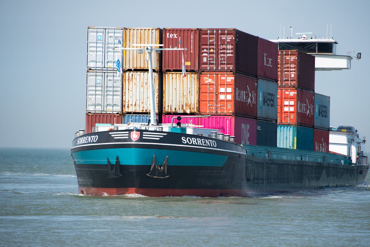 Cargo vessel under way for VOYWAR 2025 alternative route freight adjustment