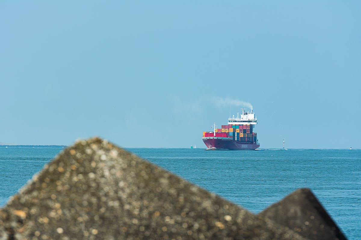 Container ship at sea for VOYWAR 2025 explained voyage charter risk analysis