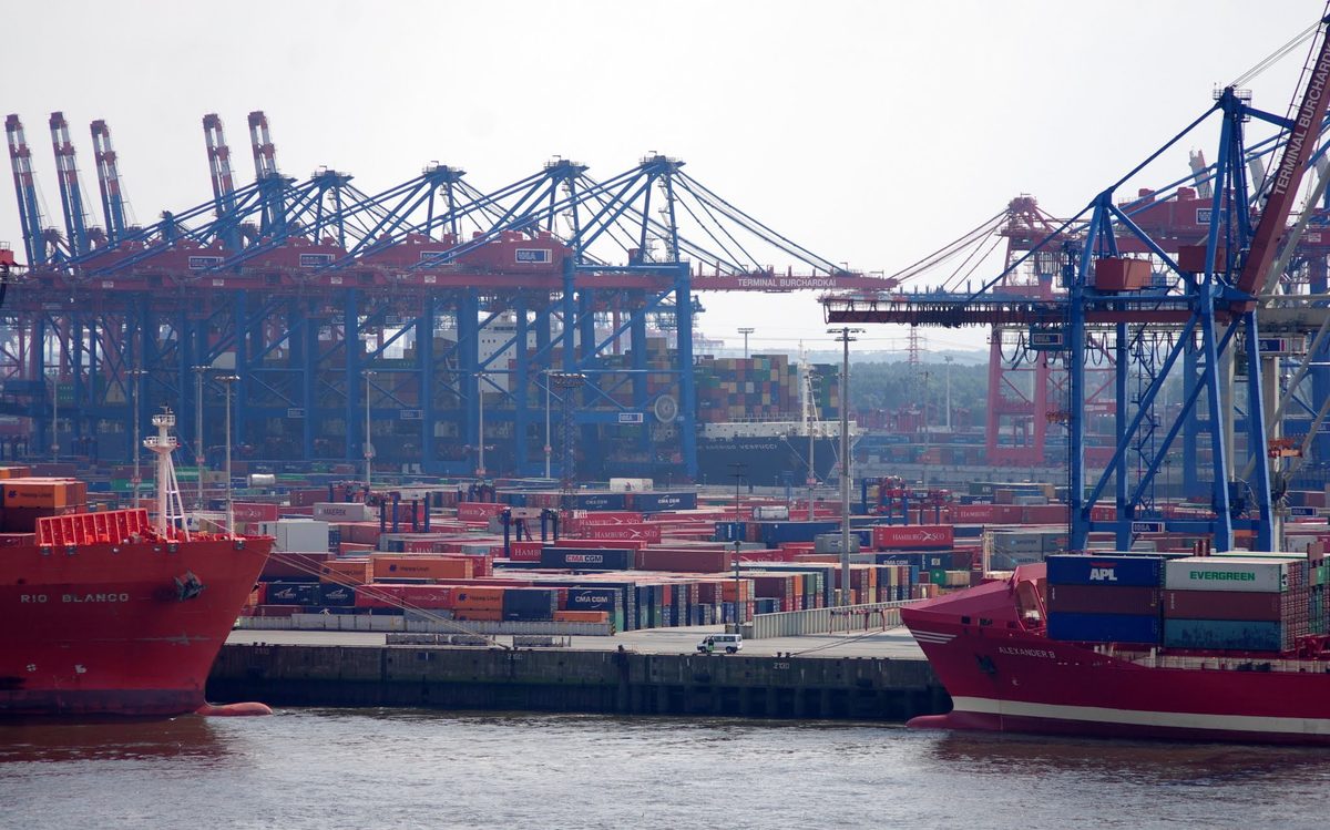 Container cranes and yard operations tied to Gulf route security surcharge pricing